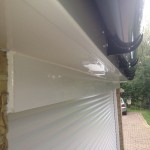 Fascia above Garage With Under White Soffit