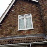 White Bargeboard with Rosewood Soffit and White Dentil Blocks